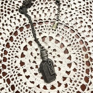 Drink Me Alice in Wonderland necklace